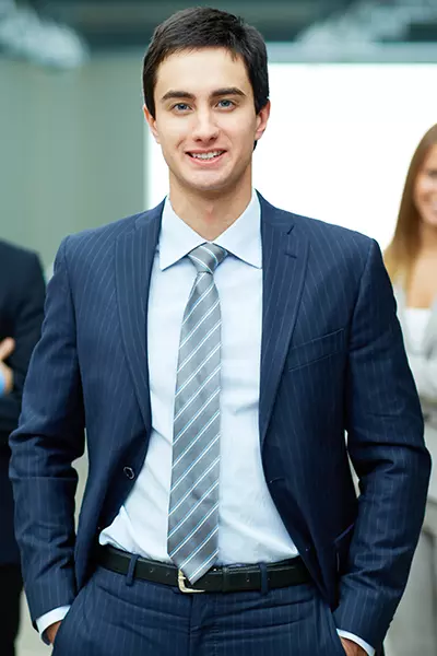 smiling young businessman - Kersey Kare